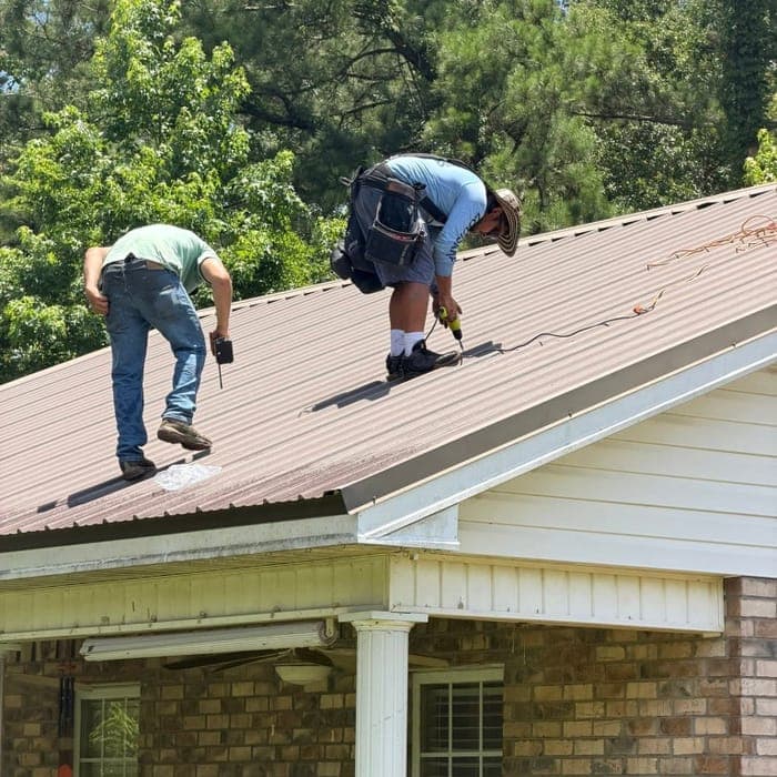 Lee Roofing team installing a metal roof